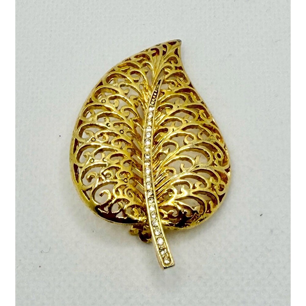 Vintage Gold Tone Metal Filigree Leaf Brooch with Rhinestone Stem